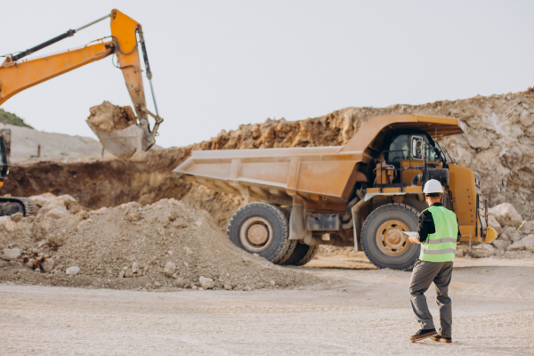 off-highway worker with bulldozer in sand quarry Endego 